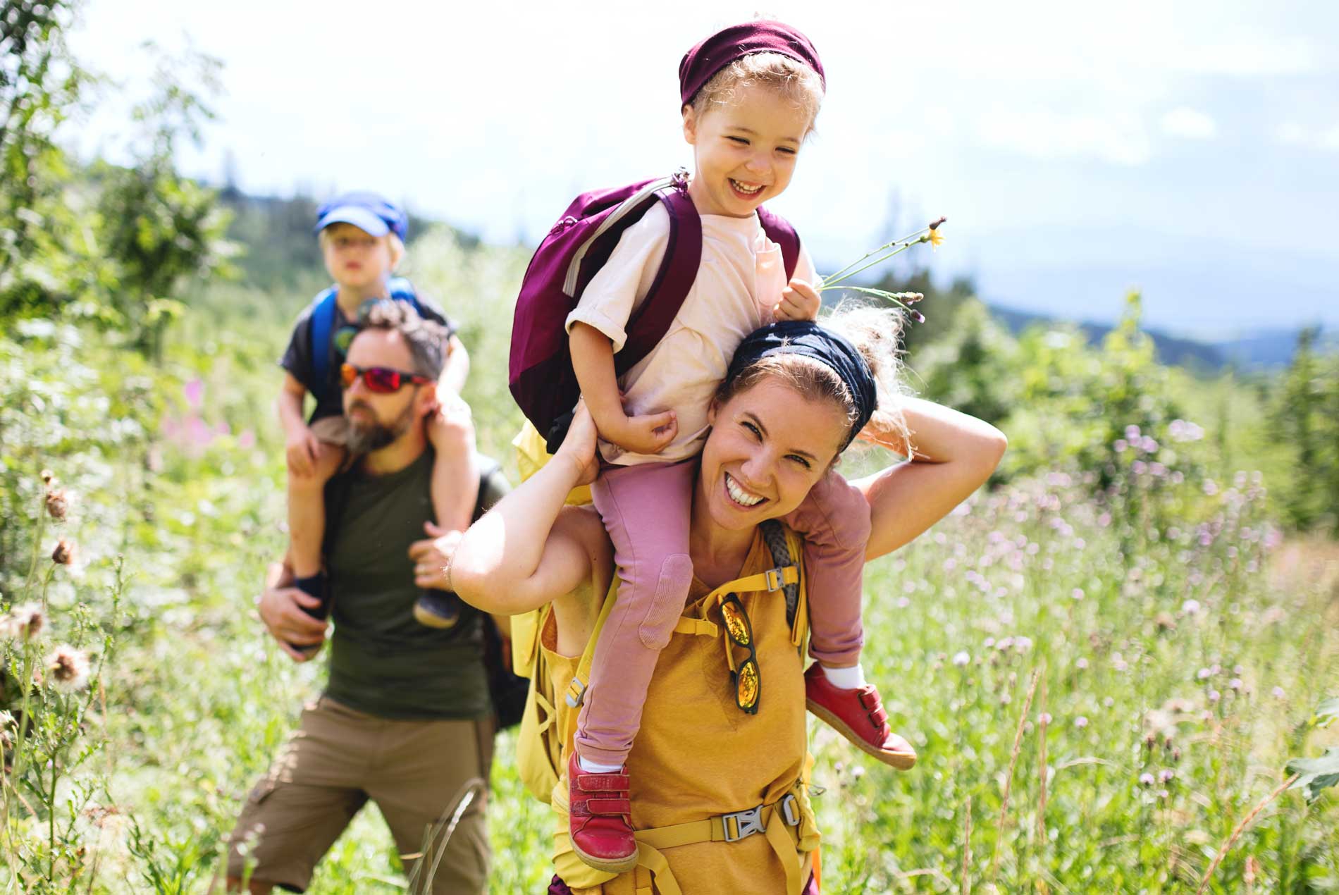 Woman with energy hiking with her family.